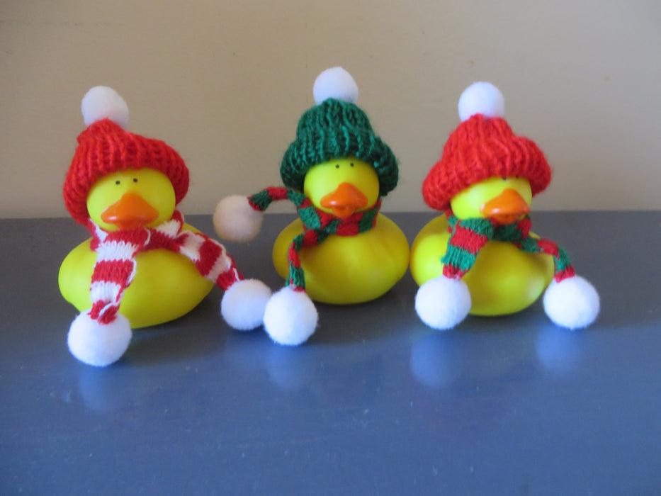 Rubber ducks with knit beanies and winter scarves