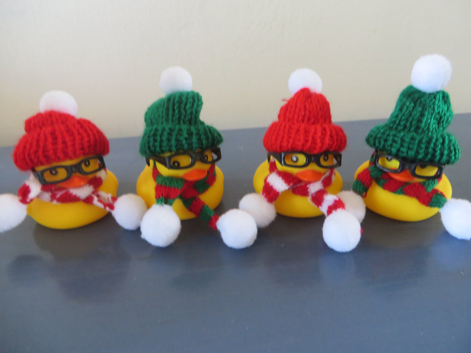 Christmas Nerd Rubber ducks with knit beanies glasses, and winter scarves