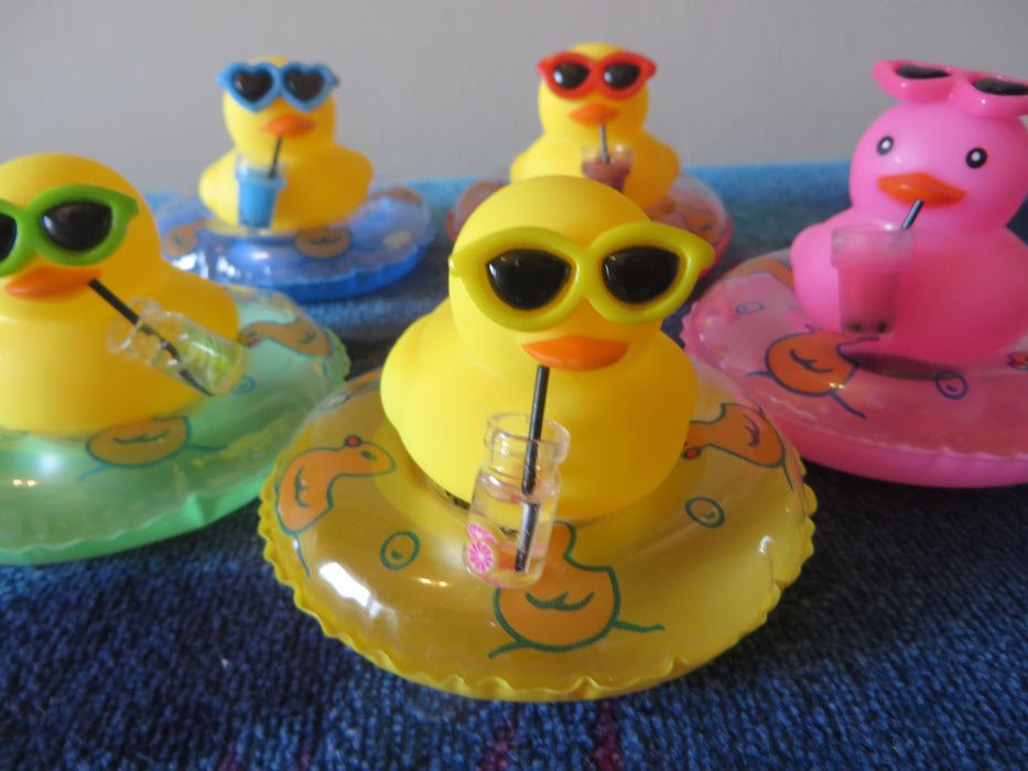 Rubber duckies on tubes - ready for the pool, drink in hand (I mean wing) - choice of color