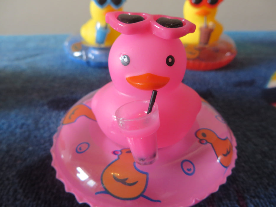 Rubber duckies on tubes - ready for the pool, drink in hand (I mean wing) - choice of color