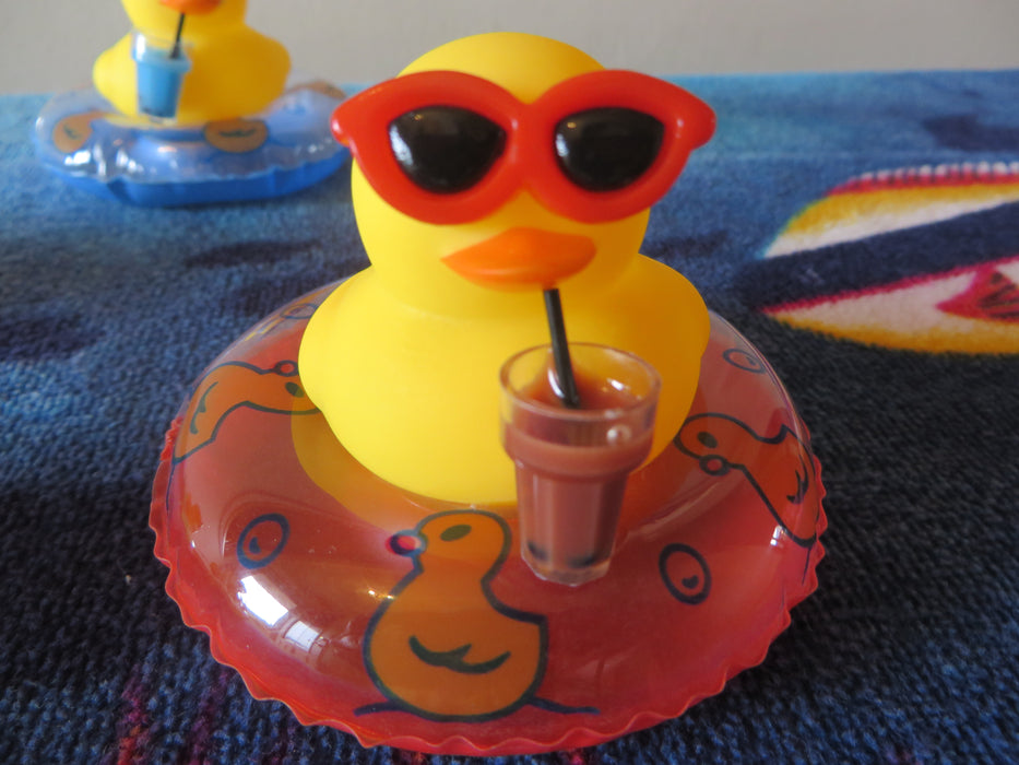 Rubber duckies on tubes - ready for the pool, drink in hand (I mean wing) - choice of color